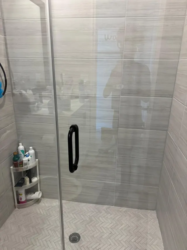 Glass shower door cleaned streak-free