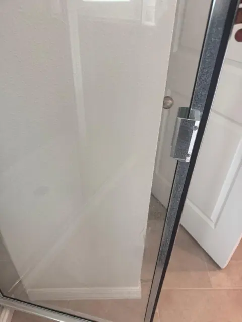 Detail of a clean glass shower enclosure